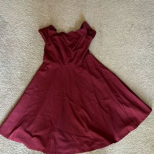 Red, tea length dress with scalloped edges